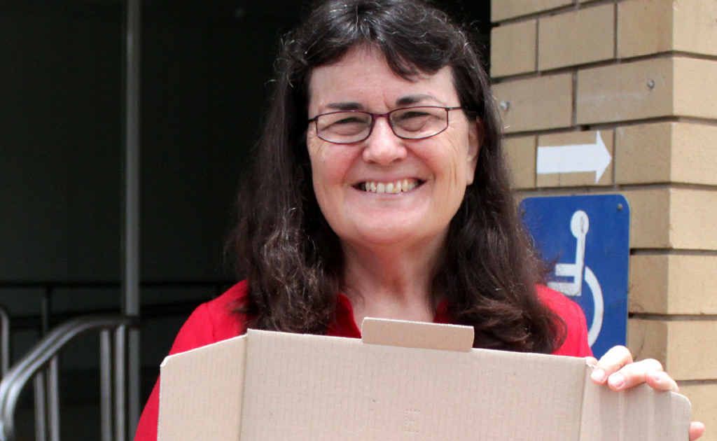 Margaret Mallyon with a care box for an Aussie serving overseas. Margaret Mallyon with a care box for an Aussie serving overseas.